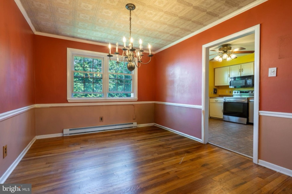 Raw listing photo — dining room and kitchen